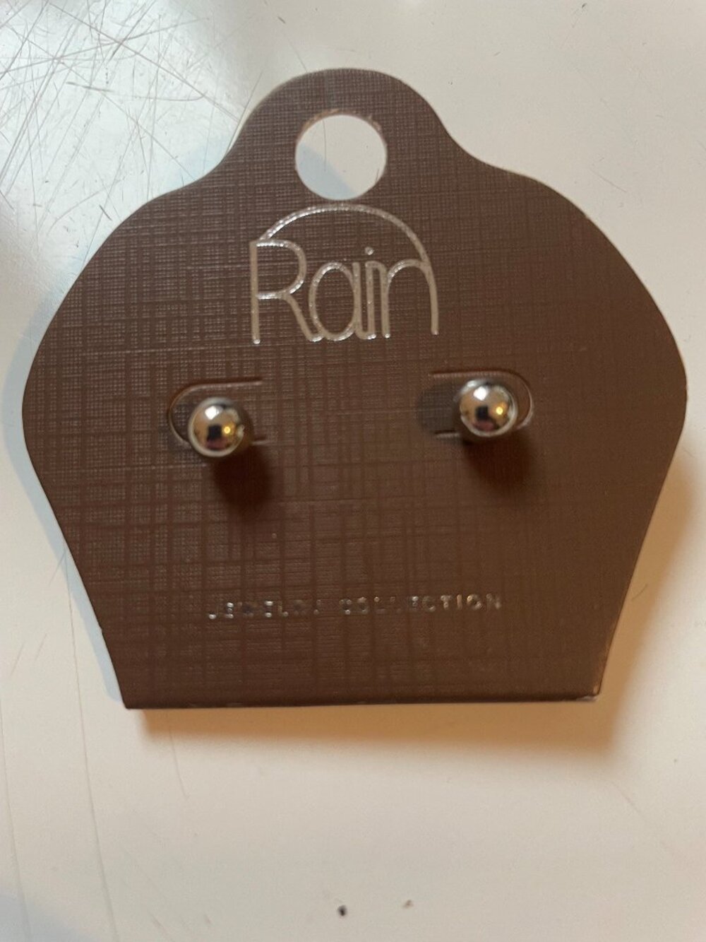 Rain silver post earrings, NWT.